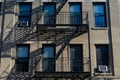 Simple Old Apartment Building Exterior with a Fire Escape in New York City Royalty Free Stock Photo