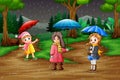 Cartoon three girl carrying umbrella under the rain in the forest Royalty Free Stock Photo
