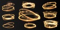 Set Golden glowing shiny spiral lines and circle light effect. Abstract Glowing light fire ring trace. Royalty Free Stock Photo