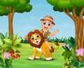 Happy zookeeper boy and lion in a beautiful garden Royalty Free Stock Photo