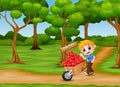 Cartoon boy pushing a pile of hearts in wood trolley on the garden path Royalty Free Stock Photo