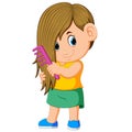 The girl is combing her hair with the pink comb Royalty Free Stock Photo