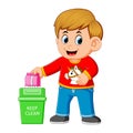 A boy keep clean environment by trush in rubbish bin