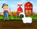 Farmer with a sheep in front of his barn