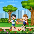 Two boys go to school through the park road Royalty Free Stock Photo