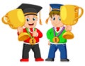 Two boys is holding their big thropy on the graduation`s day