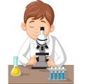 Young boy using microscope on the laboratory