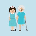 Nurse helping senior patient with a cane.