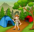 Boy in explorer outfit camping out in nature Royalty Free Stock Photo