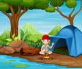 Boy scout sitting at camping site
