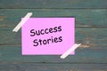 Success stories on pink paper