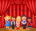 Children performing singing on the stage