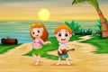 Boy playing guitar and hawaiian girl hula dancing at seaside Royalty Free Stock Photo