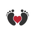 Baby feet print with heart in between icon. Royalty Free Stock Photo