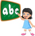 A girl stands in front of the blackboard with a pointer Royalty Free Stock Photo
