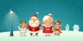 Santa Claus his wife Mrs Claus and Reindeers celebrate Christmas - winter night scene Royalty Free Stock Photo