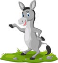 Cute donkey cartoon waving hand on the grass Royalty Free Stock Photo