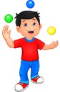 Cute boy is juggling with 3 small balls