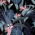 Abstract vintage colors seamless tropical pattern with pink blue leaves and flowers on black vintage background.