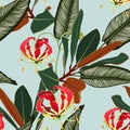 Tropical jungle plants, exotic green leaves and Gloriosa glory lily flower on vintage mint background.