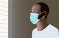Sad black man wearing medical face mask looking out the window
