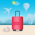 Red travel suitcase with wheels outdoors