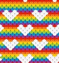 Bright seamless pattern with white hearts in rainbow baclground. LGBT pride symbols.