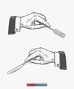 Hand drawn hands holding fork and knife. Engraved style vector illustration. Royalty Free Stock Photo