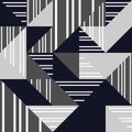 Seamless pattern. Striped triangles of dark blue, light and dark gray colors on white background. Royalty Free Stock Photo