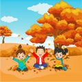 Cartoon Happy kids playing in autumn background Royalty Free Stock Photo