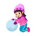 Cute little girl in winter clothes playing snowball