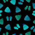 Cute blue and green gloves, wool hats on black background. Seamless winter cozy clothes pattern.