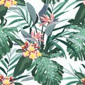 Tropical seamless pattern. Exotic flowers and leaves in vintage colors background. Royalty Free Stock Photo