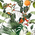 Tropical beautiful flowers pretty pattern. Seamless cute orange flowers and tropical palm leaves background. Royalty Free Stock Photo