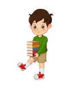 Happy cute little boy holding stack of books Royalty Free Stock Photo