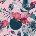 Fashionable seamless tropical pattern with tropical blue pink leaves on a dark pink background. Beautiful exotic plants. Royalty Free Stock Photo