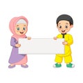 Happy Muslim kid cartoon with blank sign Royalty Free Stock Photo