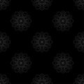 Abstract gray mandala flowers on black background. Seamless doodle pattern. Royalty Free Stock Photo