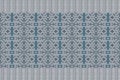 Vector seamless border, pattern. Beautiful blue embroidery pattern on a gray background. Royalty Free Stock Photo