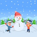 Two kids playing under the falling snow and making snowman