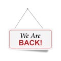 We are back word on sign on white Royalty Free Stock Photo