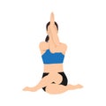 Woman doing cow face pose with eagle arms gomukhasana garudasana