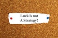 Luck is not a strategy on white paper Royalty Free Stock Photo