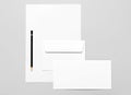 Basic stationery: sheet of paper, two envelopes and pencil Royalty Free Stock Photo