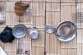 thai kitchen cooking utensils hung on traditional wood wall