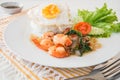 Basil fried rice with shrimp and fried egg (Pad kra prao kung), Royalty Free Stock Photo