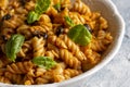 Basil leaves on pasta with arabiata sauce