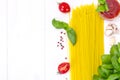 Basil, Red Cherry Tomato with Pasta on White Woody Background Royalty Free Stock Photo