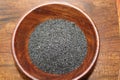 Basil seeds or sabja seeds in wooden bowl