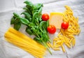 Basil, tomatoes, parmesan, cappellini and penne pasta